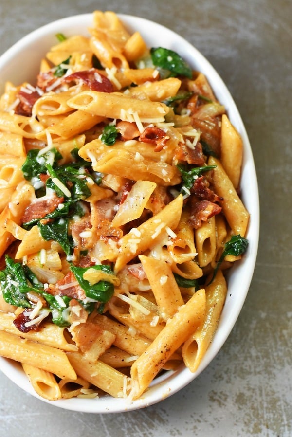 bacon-and-spinach-pasta in white dish