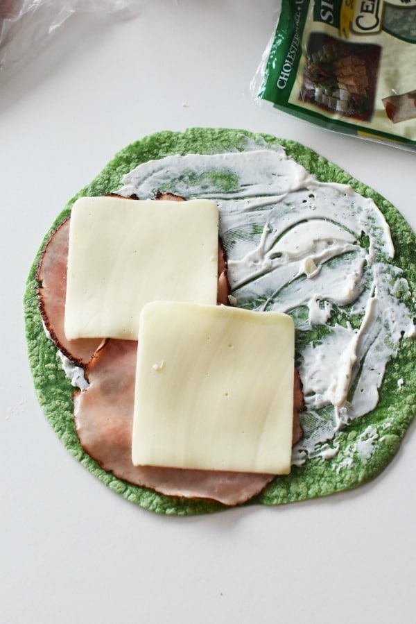 meat and cheese on green wrap