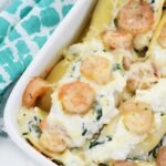Baked Shrimp Scampi Stuffed Shells in a white casserole dish