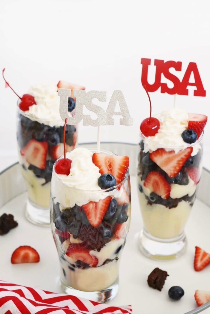 brownie parfaits with whipped cream and cherry 