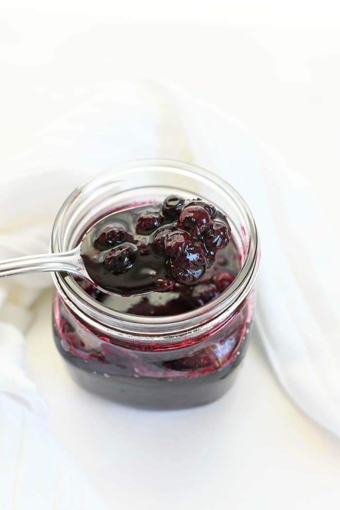 Fresh Blueberry compote in clear jar.