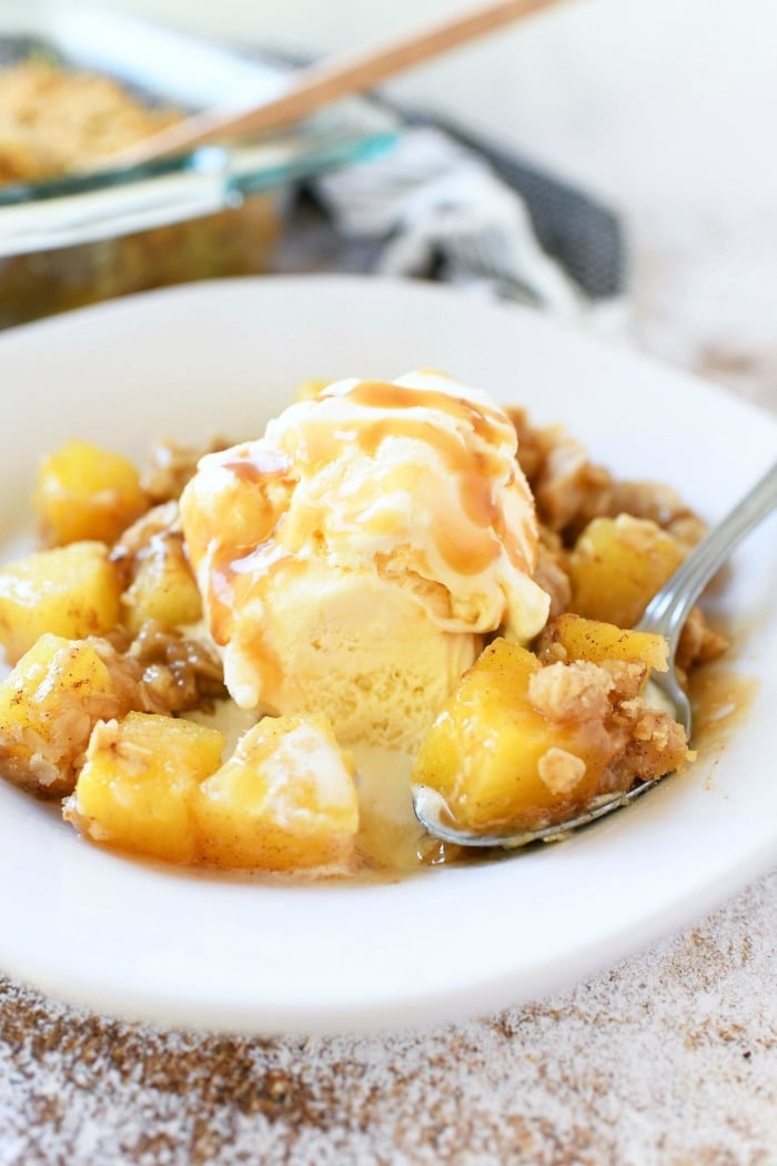 Pineapple Crisp with vanilla Ice Cream on dish.
