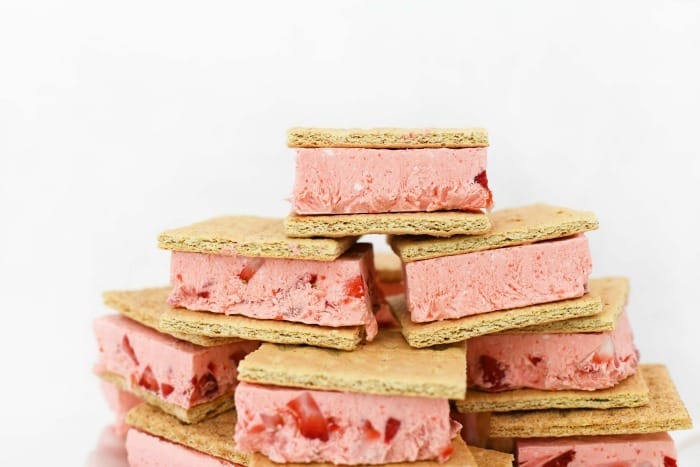 Frozen Strawberry Jello Sandwiches stacked on top of each other. 