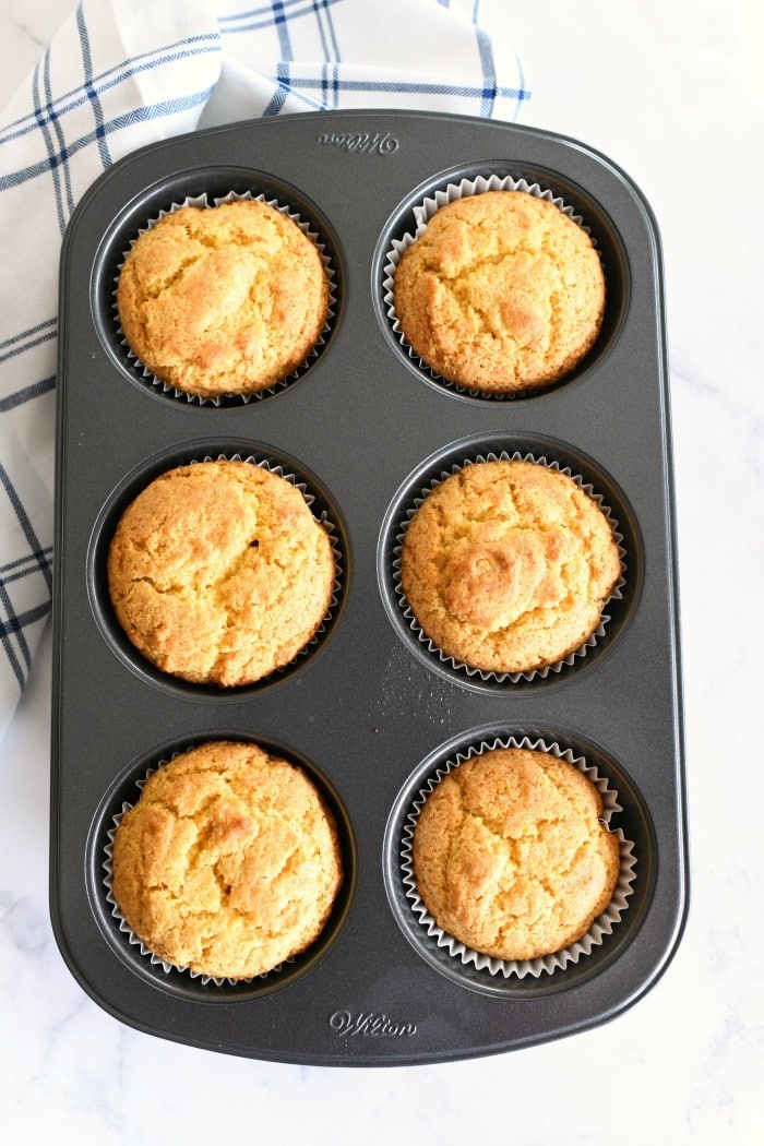 6 jumbo corn muffins in a baking tin