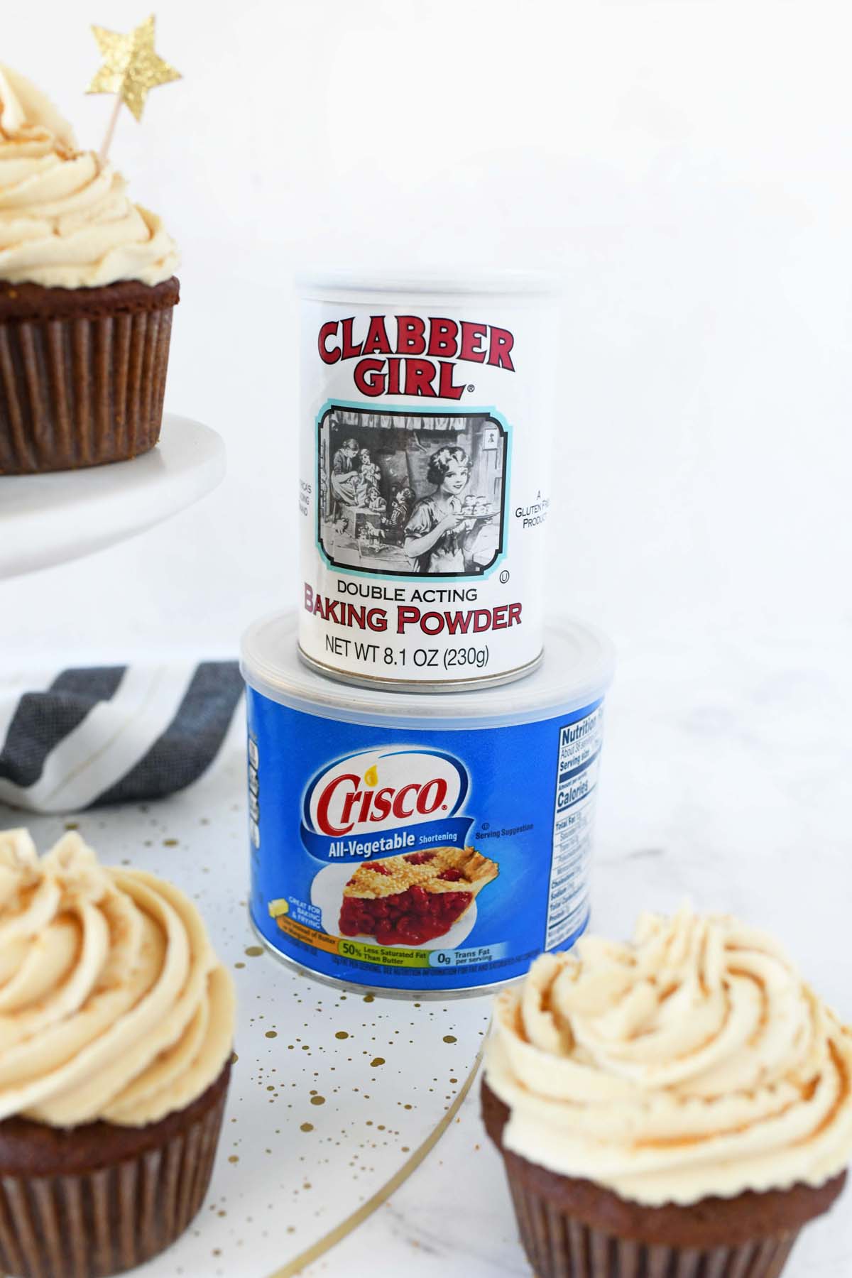 Clabber Girl and Crisco products near baked gingerbread cupcakes.