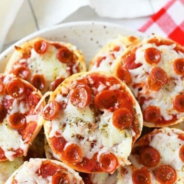 Air Fried Mini Pepperoni Bagel Pizzas on a white plate.