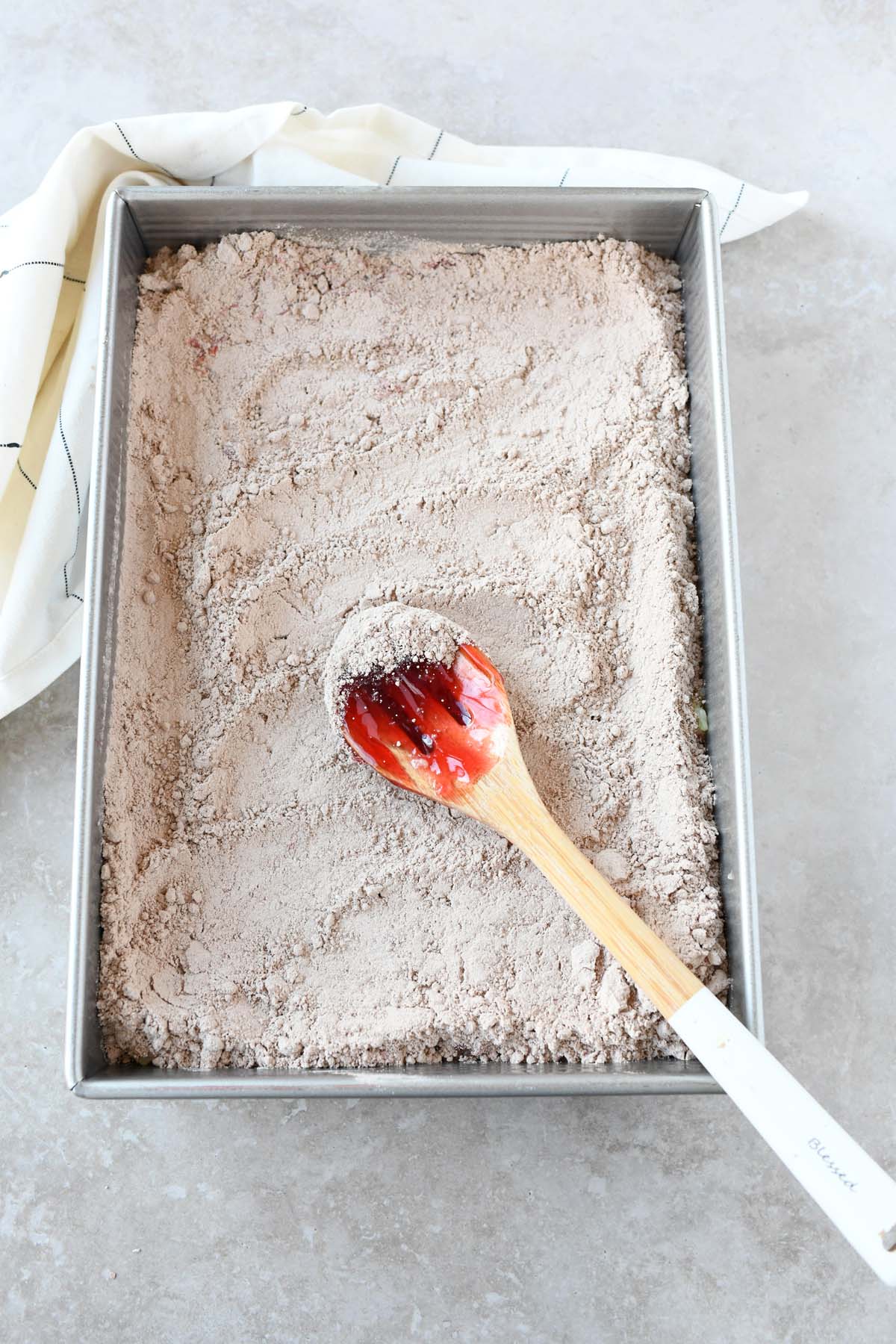 Smooth dry cake mix in a cake pan.