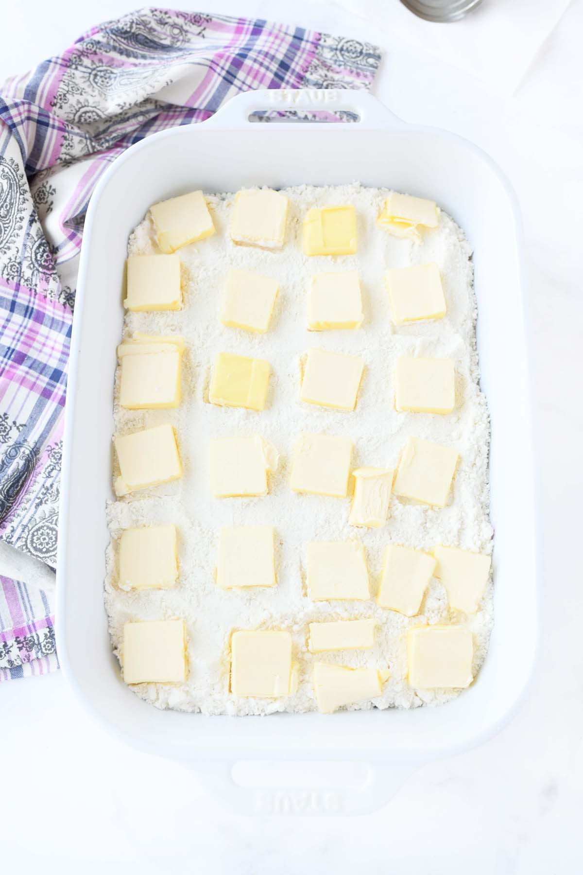 Butter pads on lemon cake mix.