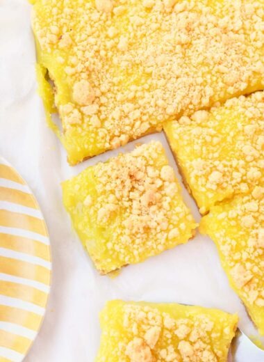 Vibrant yellow cake mix bars with crumble on top.