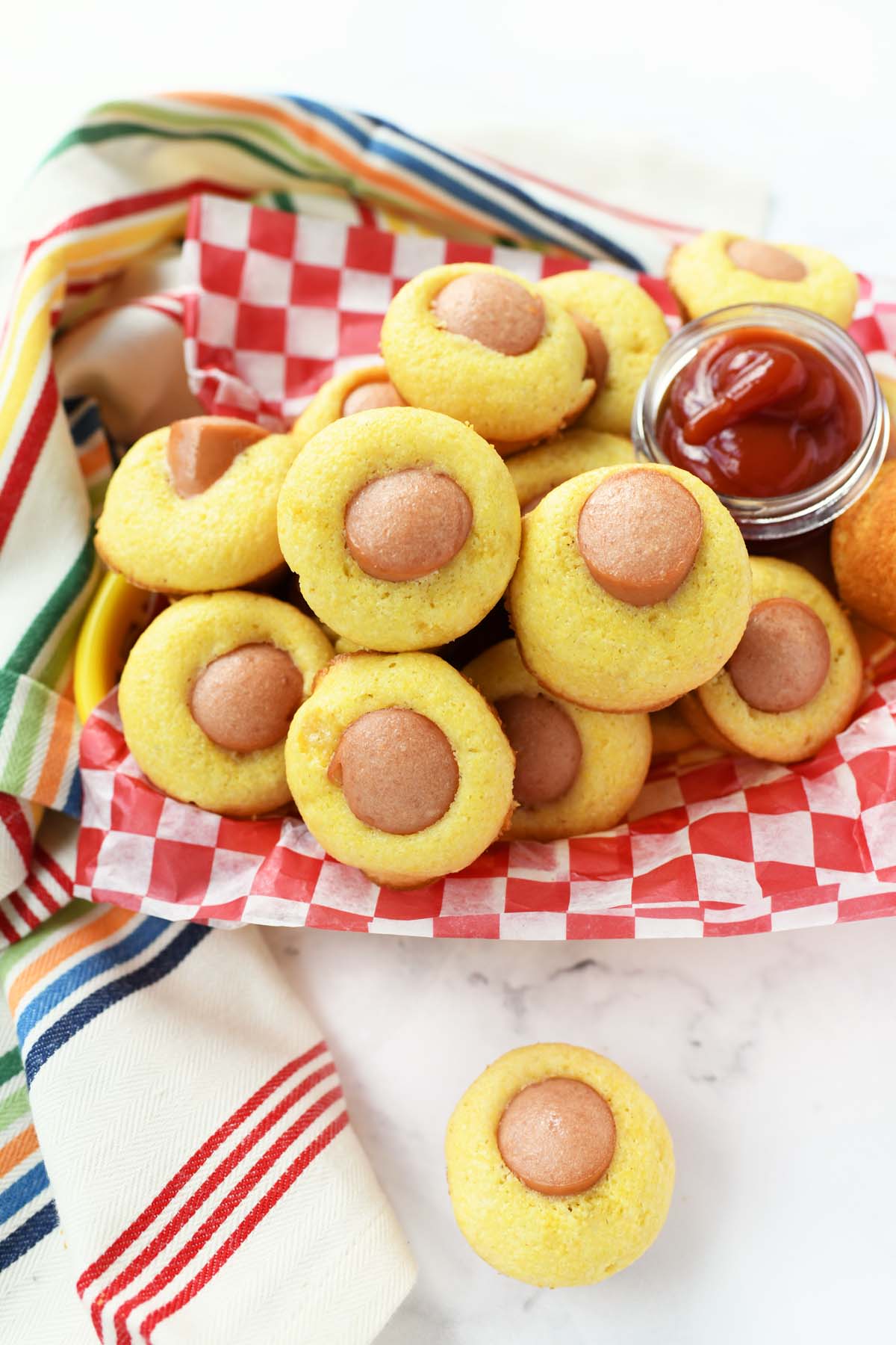 Jiffy Mini Corn Dogs in a red and white checkered basket.