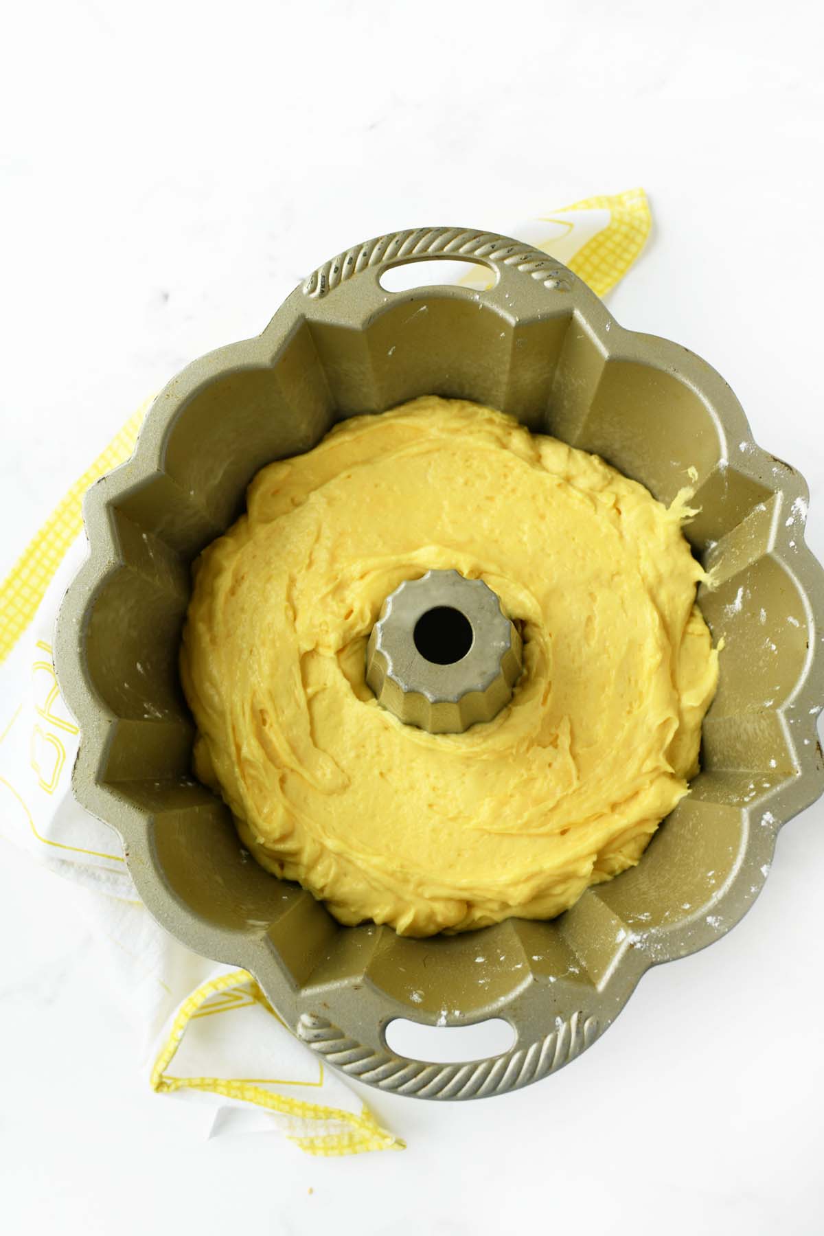 Pineapple cake batter in bundt pan.