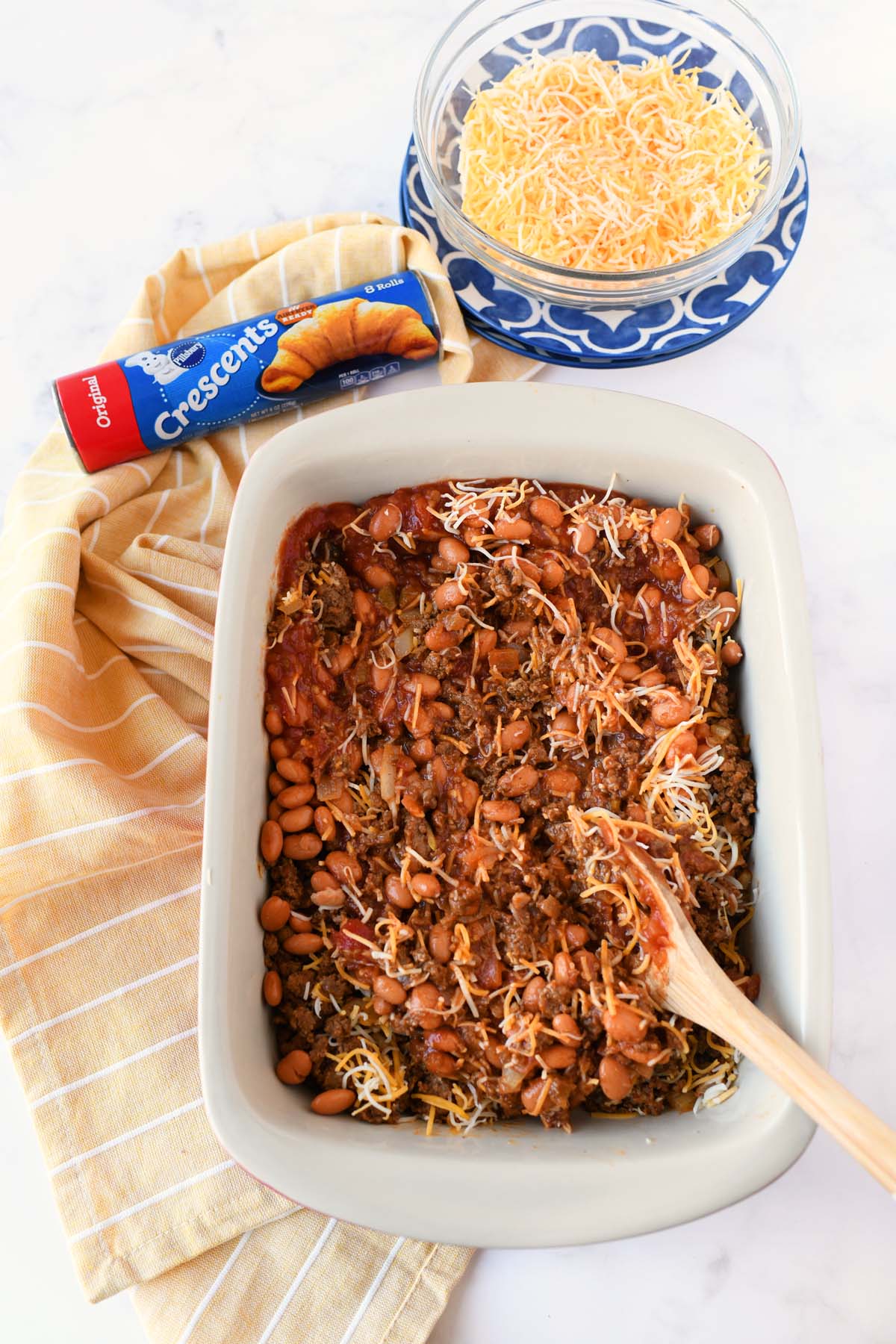 A casserole dish with meat and beans inside.