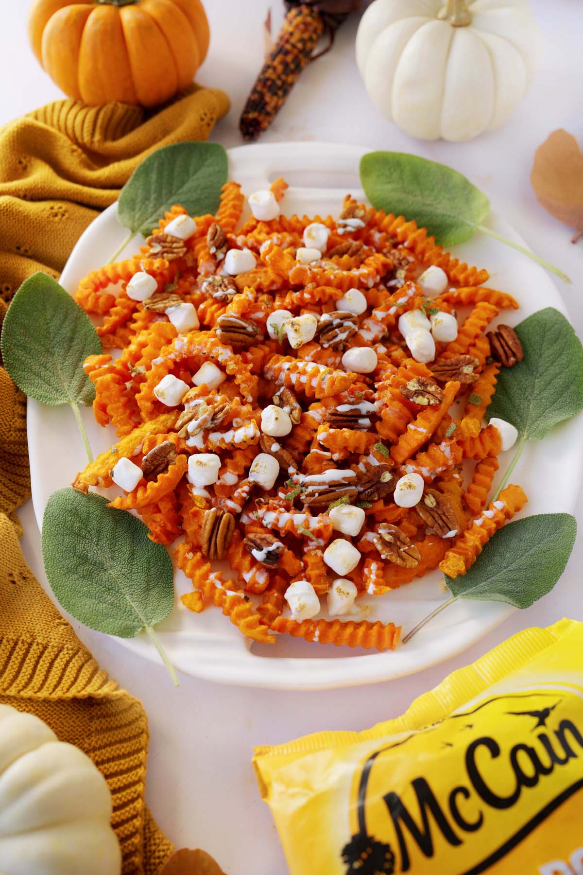 A platter of McCain Sweet Potato fries on a harvest themed table.