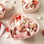 Strawberries and Cream cereal mix in heart-shaped bowls.