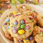 Up close shot of Easter Candy cookies which contain pastel Cadbury eggs and pastel M&Ms.