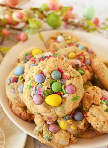 Up close shot of Easter Candy cookies which contain pastel Cadbury eggs and pastel M&Ms.