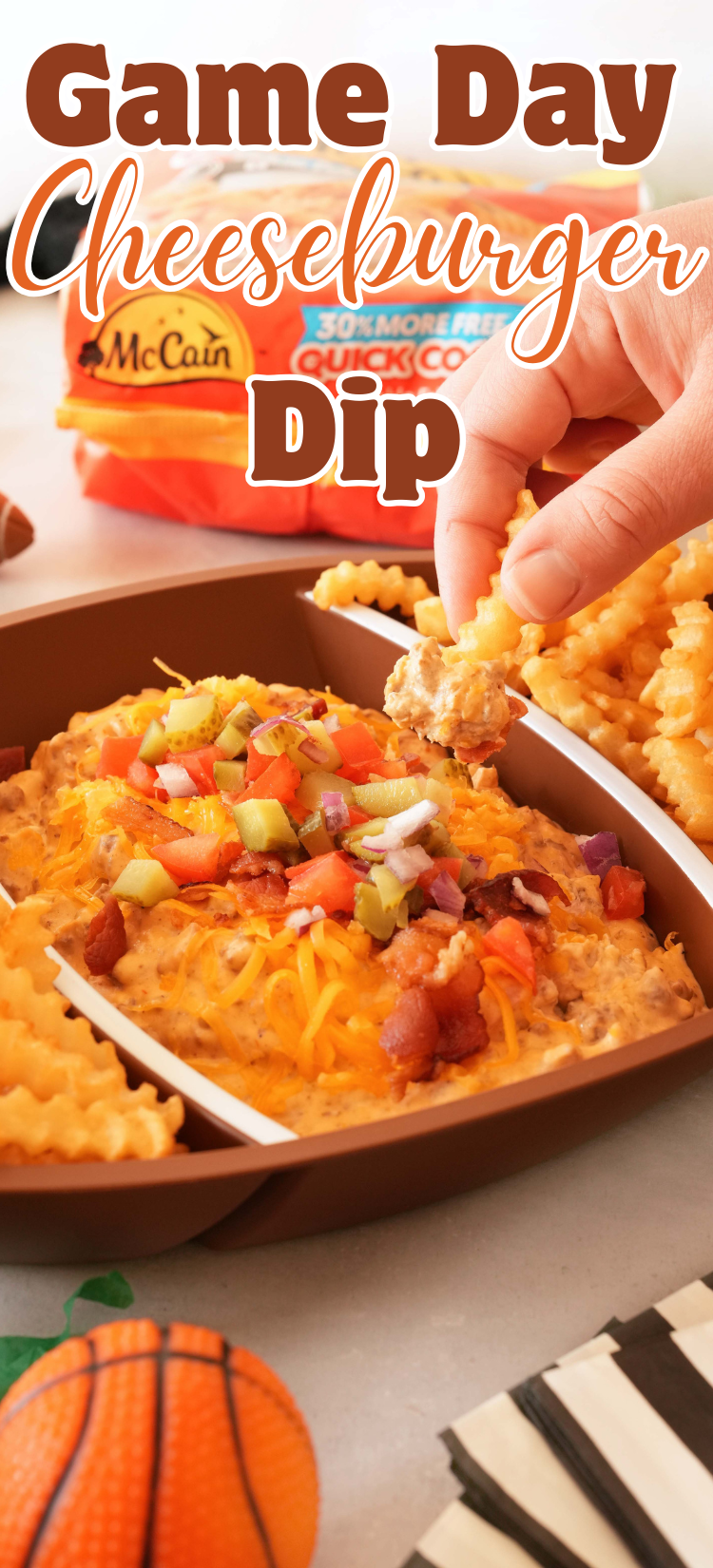 A hand dipping into cheeseburger dip. Pin image reads: Game Day Cheeseburger Dip