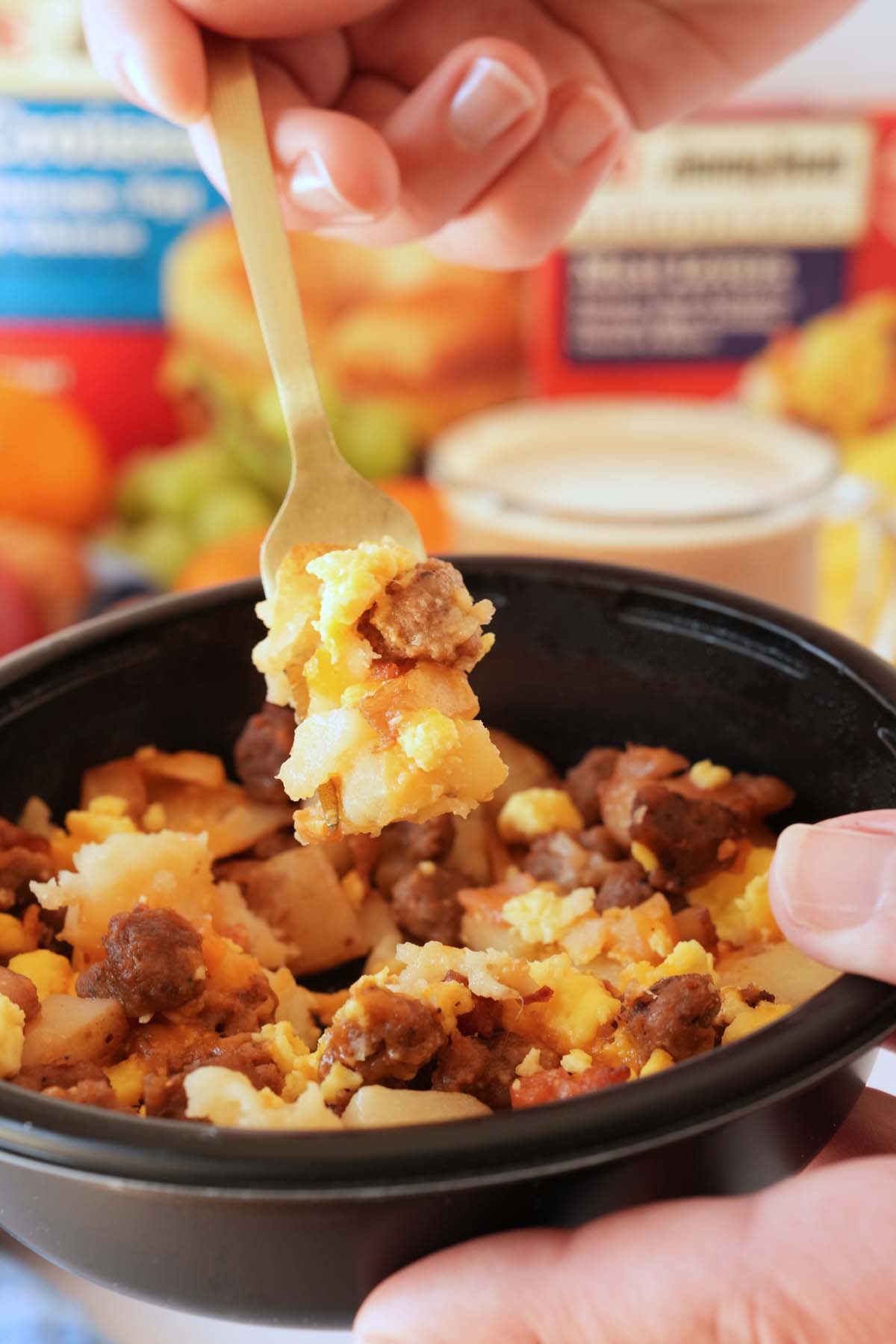 Up close shot of Jimmy Dean Meat Lovers Bowl with food on a fork.