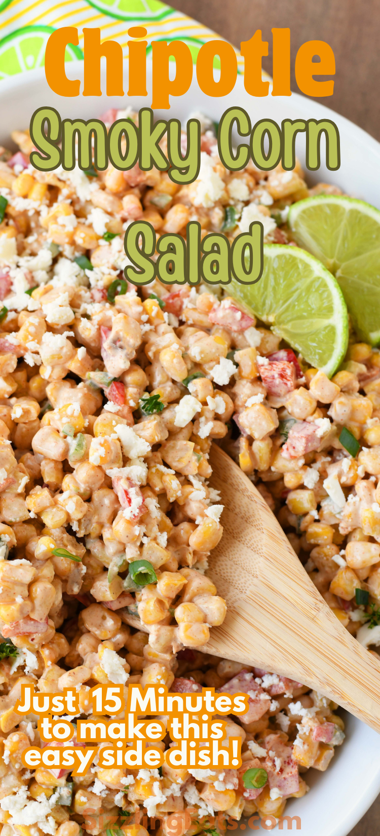 Chipotle Smoky Corn Salad with a wooden spoon and lime. Image contains text that reads: Chipotle Smoky Corn Salad.