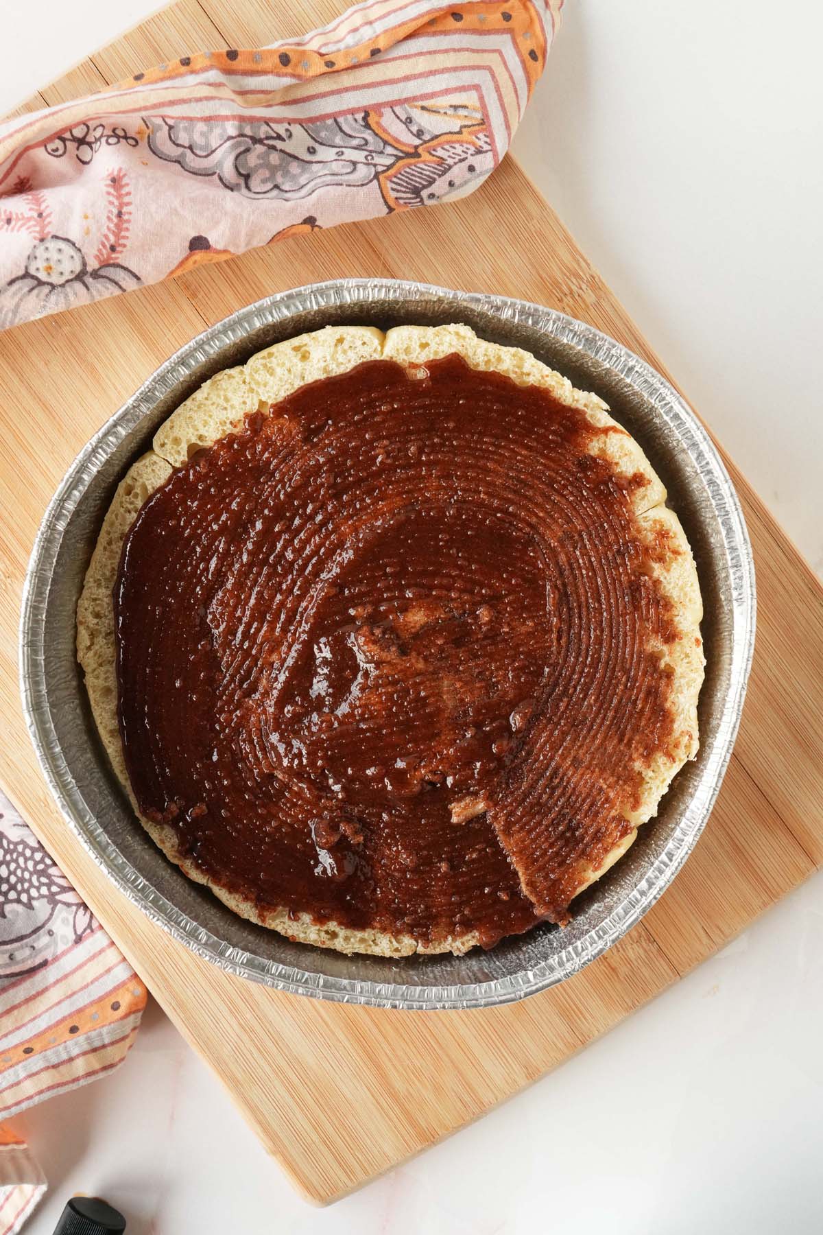 Brown sugar and cinnamon on sliced parker house buns.